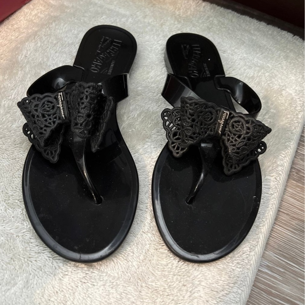 Black jelly Ferragamo shoes with bow tie
